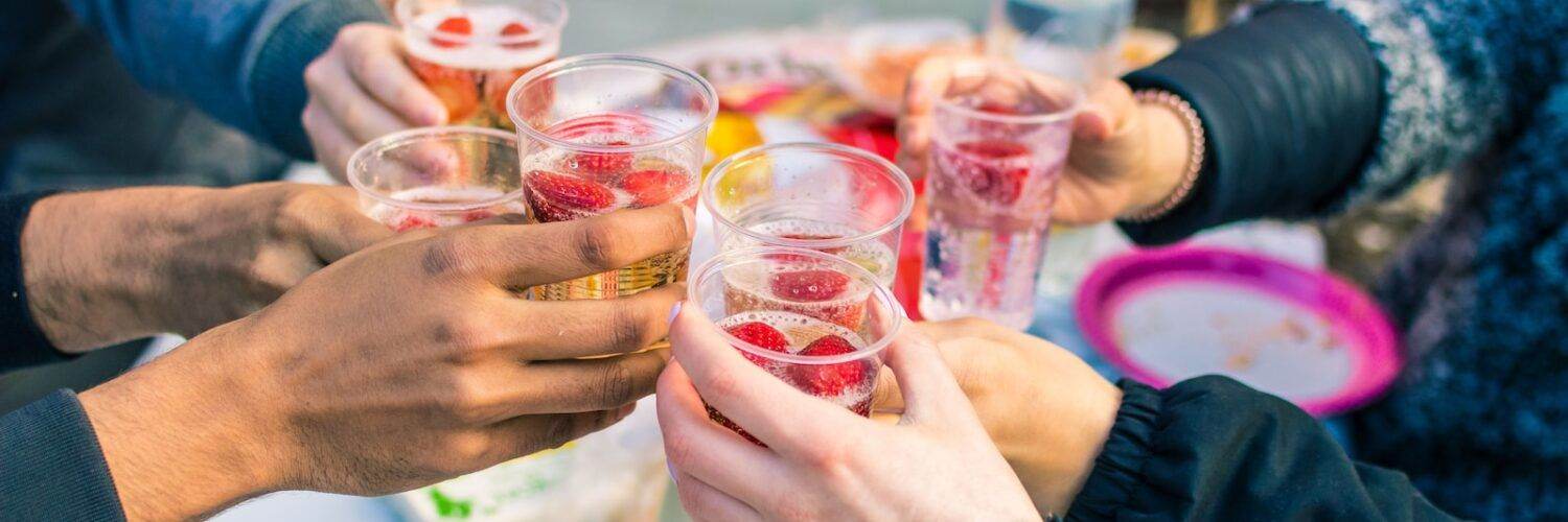 people holding clear drinking glasses