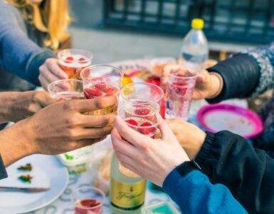 people holding clear drinking glasses