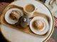 White Ceramic Mug With Coffee Beside Stainless Steel Teapot on Brown Wooden Tray