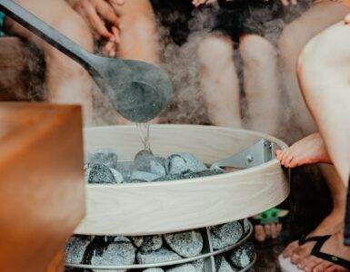 a person pouring water into a glass