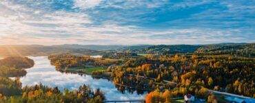 an aerial view of a lake surrounded by trees