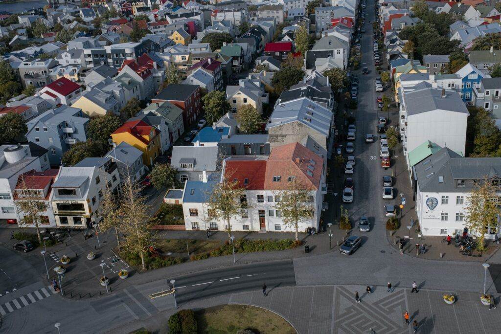 Drone Shot of Cars Parked outside Buildings