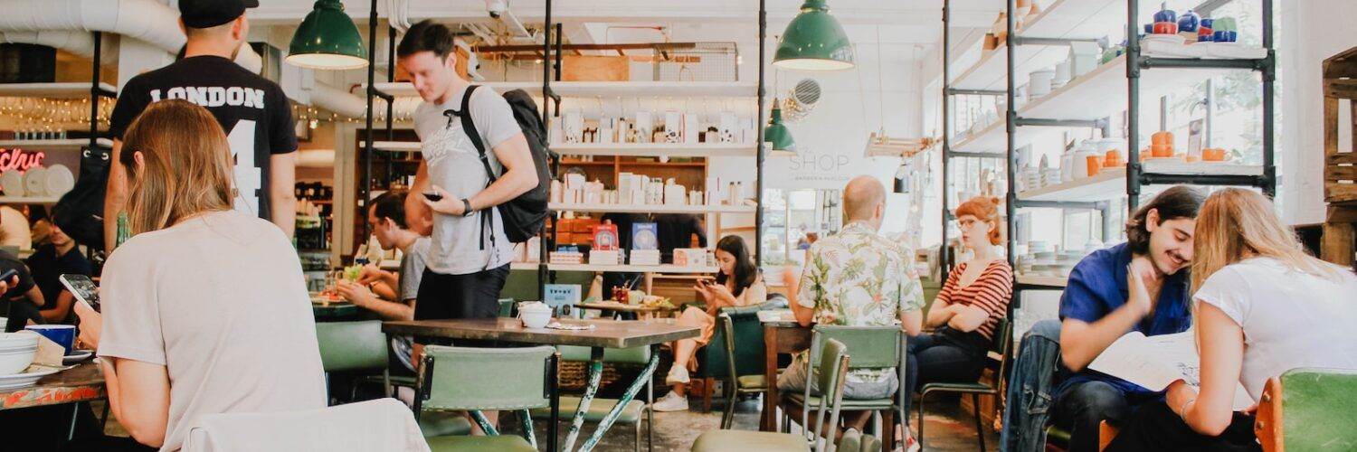 people eating inside of cafeteria during daytime