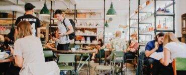 people eating inside of cafeteria during daytime