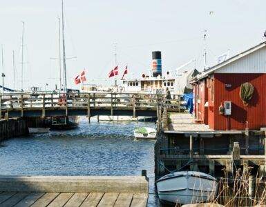 white and red boat on dock during daytime