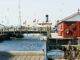 white and red boat on dock during daytime