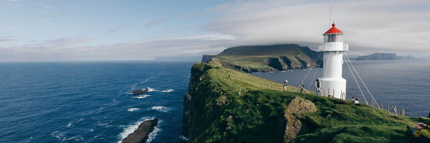 lighthouse near body of water