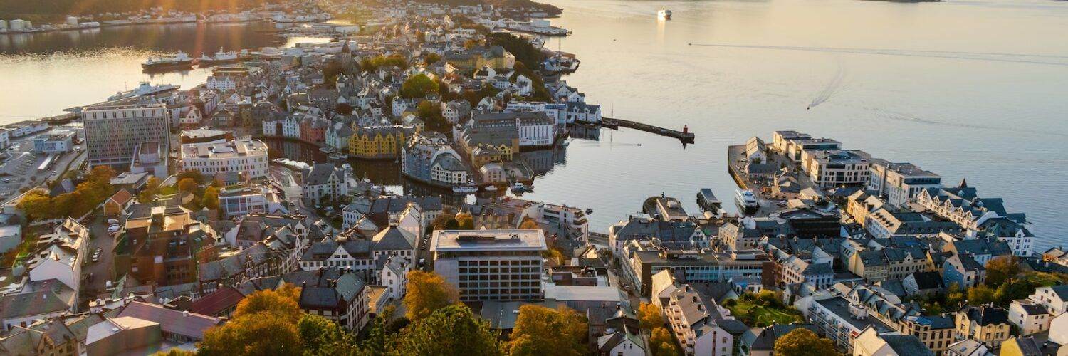 aerial view of city near body of water during daytime