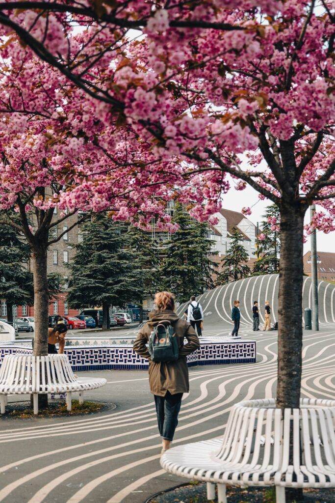 a person walking on a sidewalk