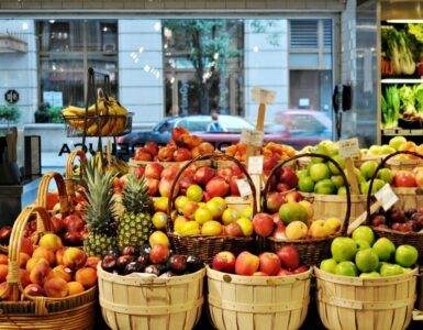 a bunch of baskets filled with different types of fruit