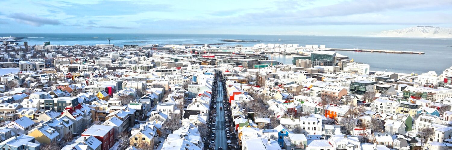 a view of a city with a lot of snow on the ground