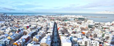 a view of a city with a lot of snow on the ground